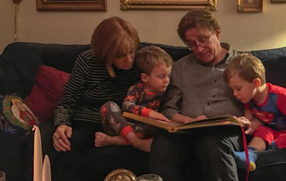 Jack and Kathy reading The Advent Book to grandchildren